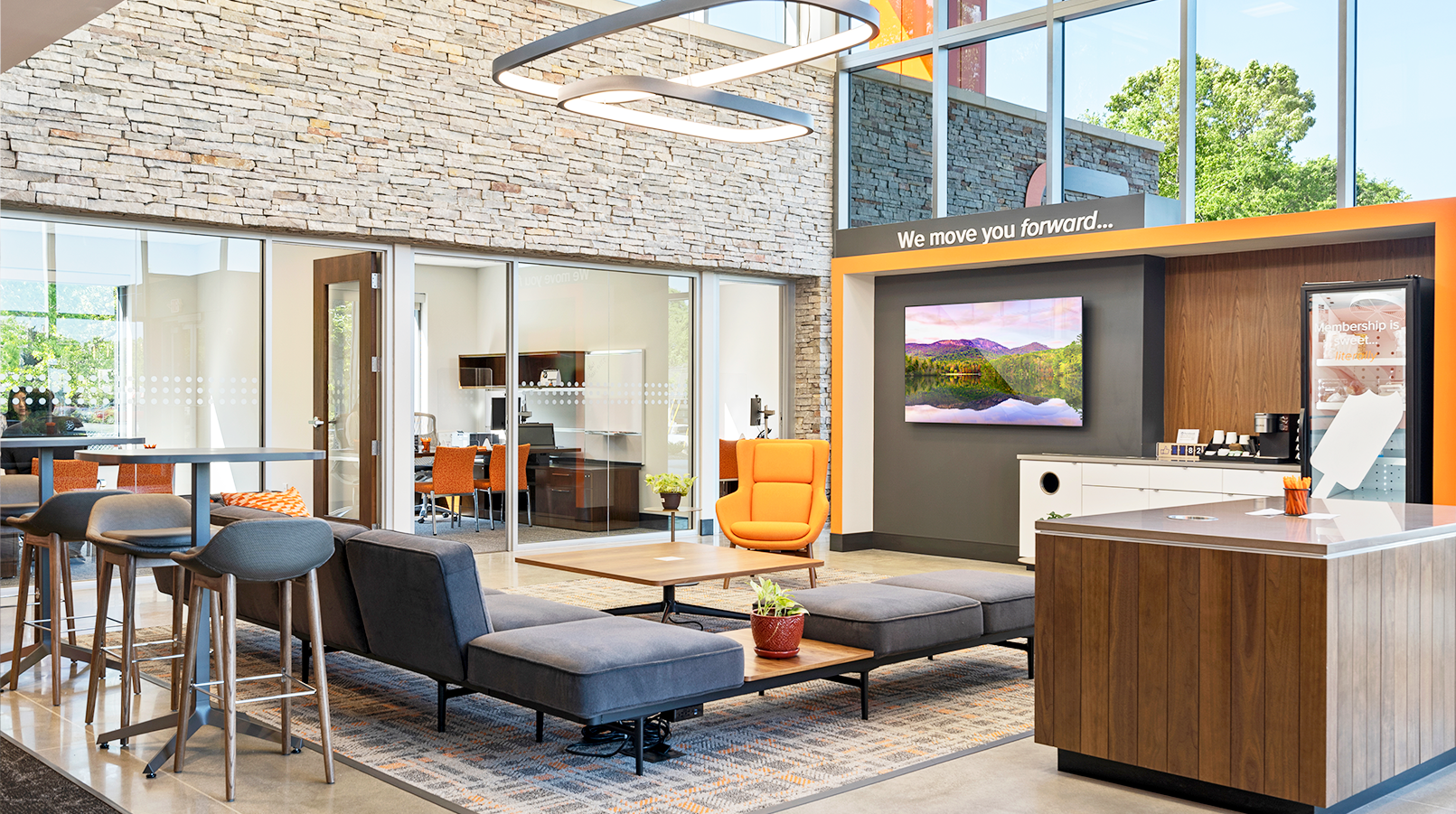 lobby sitting space with large digital screen on a technology wall