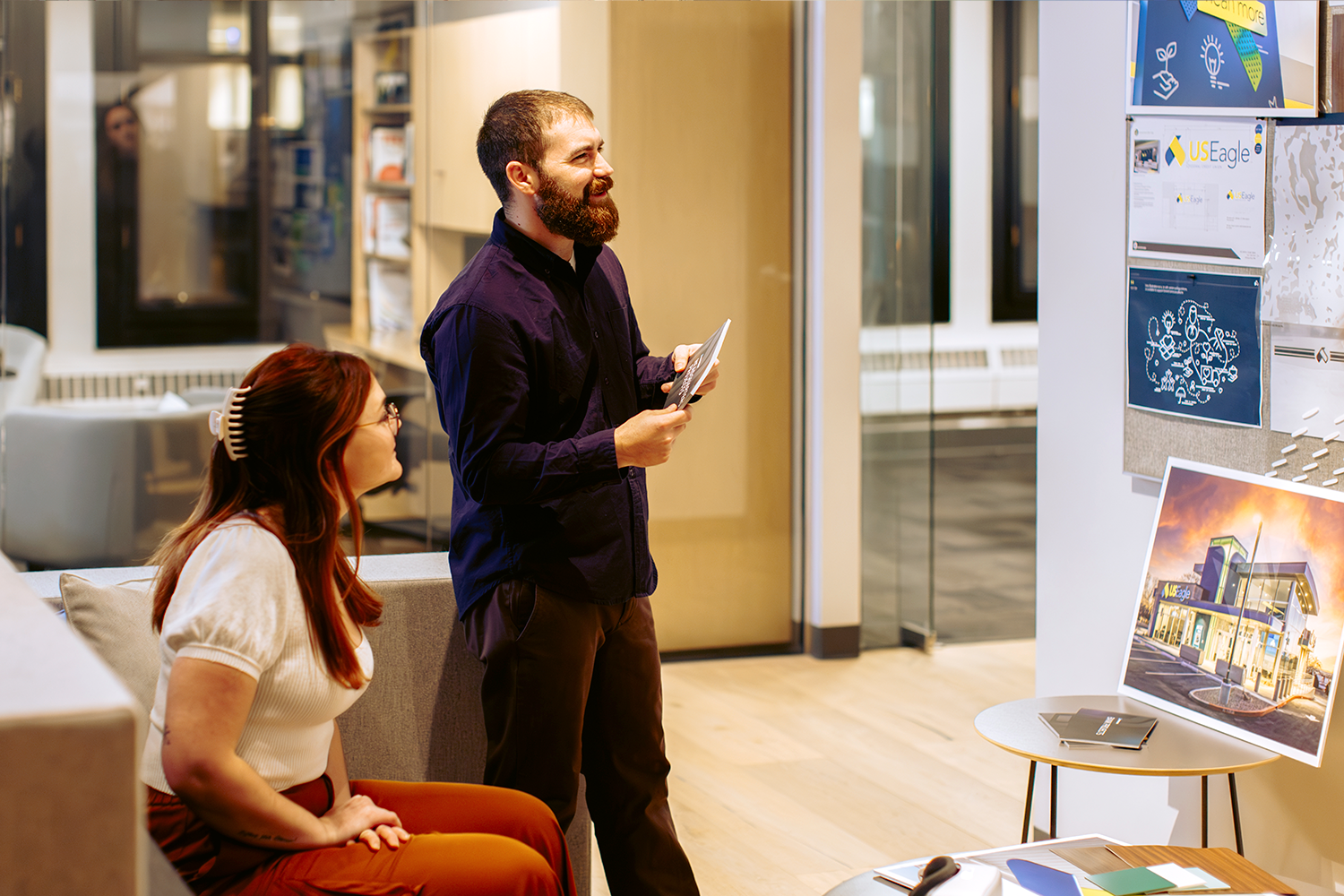 NewGround team members reviewing graphics and branding options