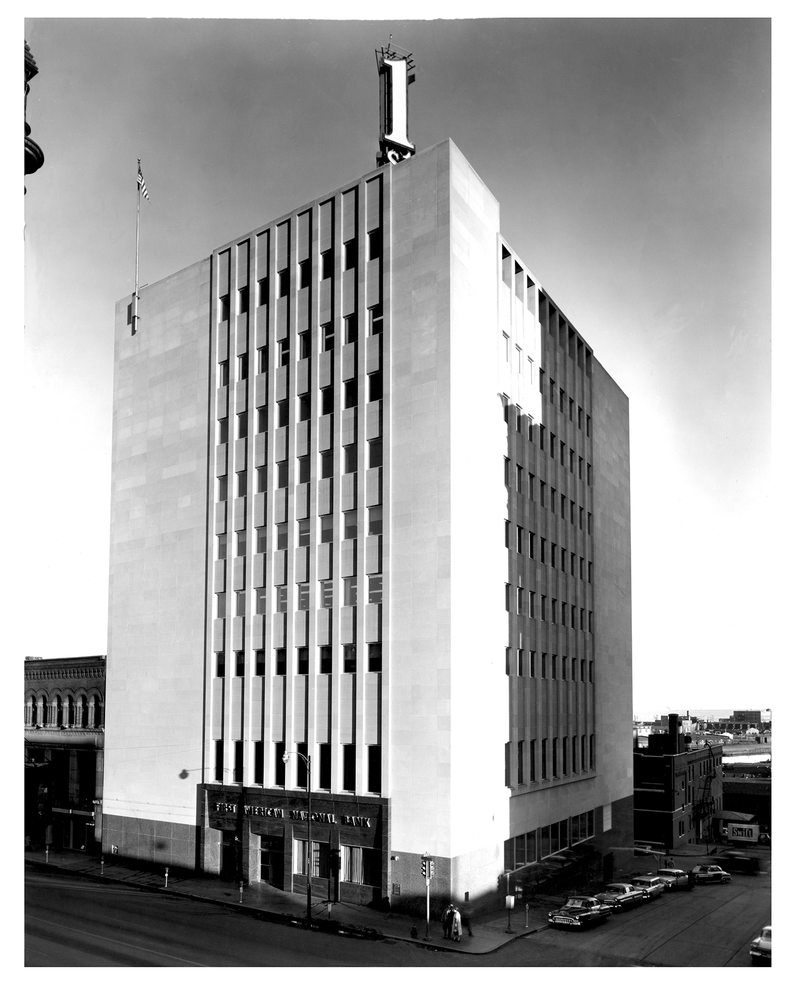 black and white photo of a multistory building