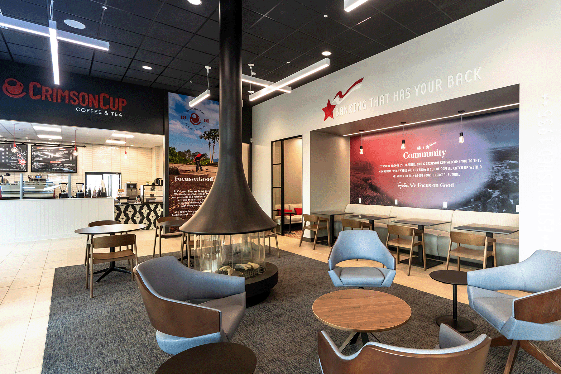 CrimsonCup Coffee & Tea counter and lobby with chairs, tables, and a circular fireplace in the middle of the space